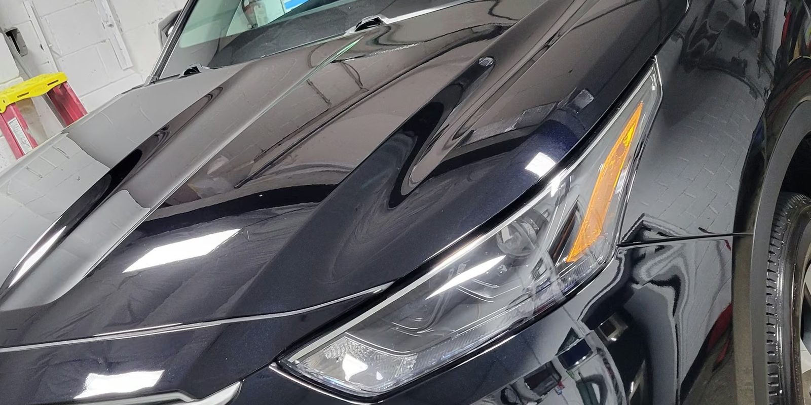 Deep reflections in a machine-polished black hood